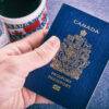 Important Skills for Immigrants in Canada: A hand holding a Canada Passport