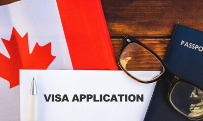 Canada visa for people living in Saudi Arabia: Image of a visa application form and flag in Canada.