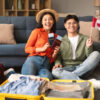 Canada Spouse Visa Processing Time: A picture showing Canada couple holding flags and passports.