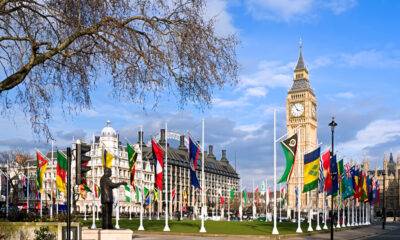 UK Visas for Commonwealth Citizens: A picture showing Big Ben in background, Parliament Square in foreground decorated with flags of the British Commonwealth.
