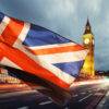 Ways You Can Travel to the UK in 2024: A picture showing union jack flag and iconic Big Ben at the palace of Westminster, London - the UK