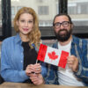 Canada Fiance Visa: A picture showing Canada partners holding Canadian flag.