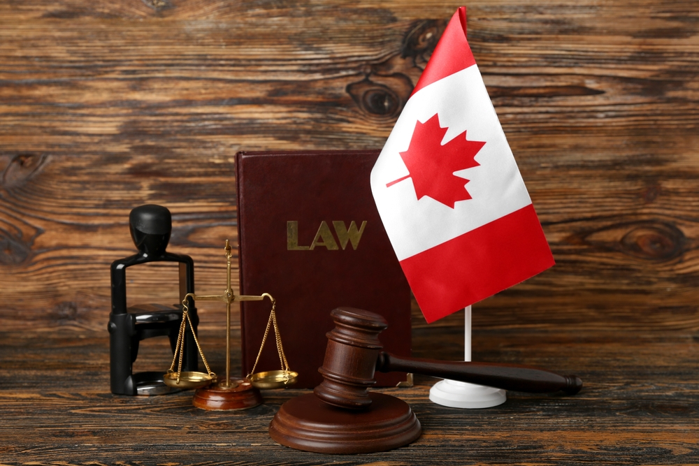 Canada Work Visa Sponsorship: A picture showing Canada flag, law book and justice symbols