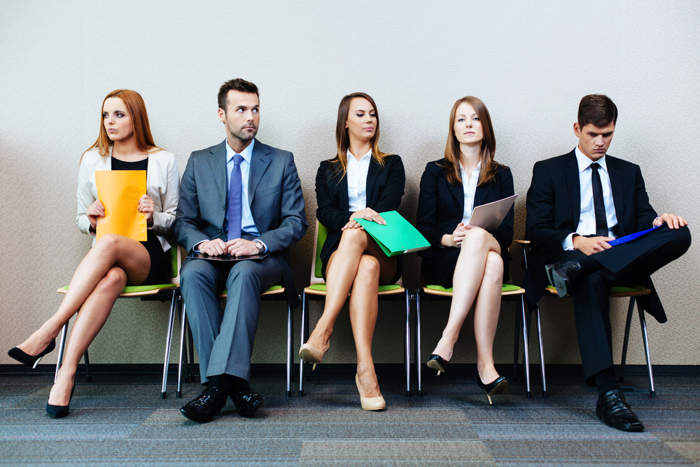 Worst Rookie Errors for First-Time UK Job Seekers: A picture showing a group of job seekers waiting for recruiters.
