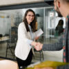 Worst Rookie Errors for First-Time UK Job Seekers: A picture showing a job seeker exchanging pleasantries with a lady recruiter.
