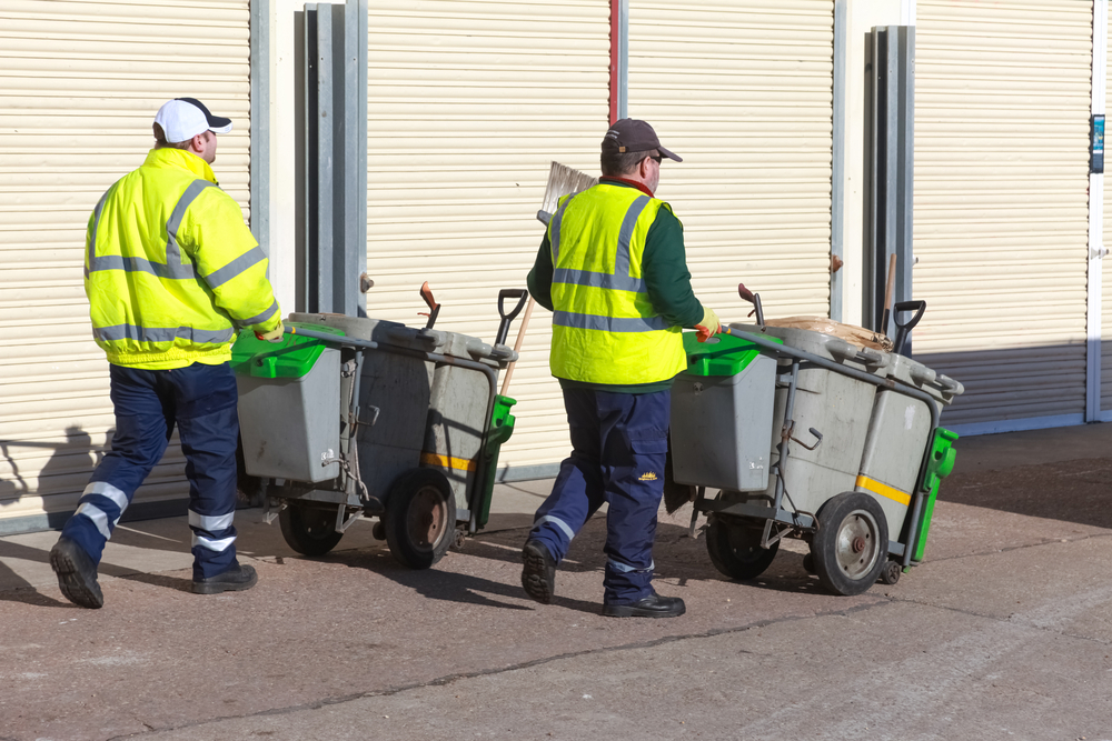 Best and Worst Cities for Finding Jobs in the UK: A picture showing two waste workers in the UK