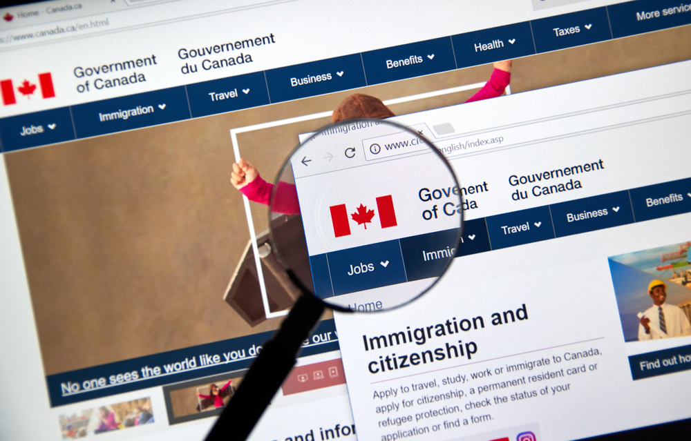 Canada Visitor Visa: A picture showing official Canadian website for immigration with lens.