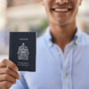 Canada Citizenship: A picture showing a man displaying Canada passport.