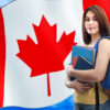 Canada Student Visa Requirements: A picture showing a student in Canadian university, holding books with Canada flag in the background.