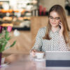 Secrets to Maintaining Work-Life Boundaries in a Remote Job: A female freelancer on a phone call and working from home