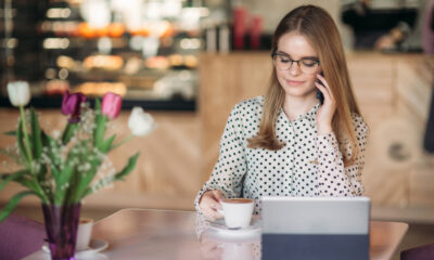 Secrets to Maintaining Work-Life Boundaries in a Remote Job: A female freelancer on a phone call and working from home