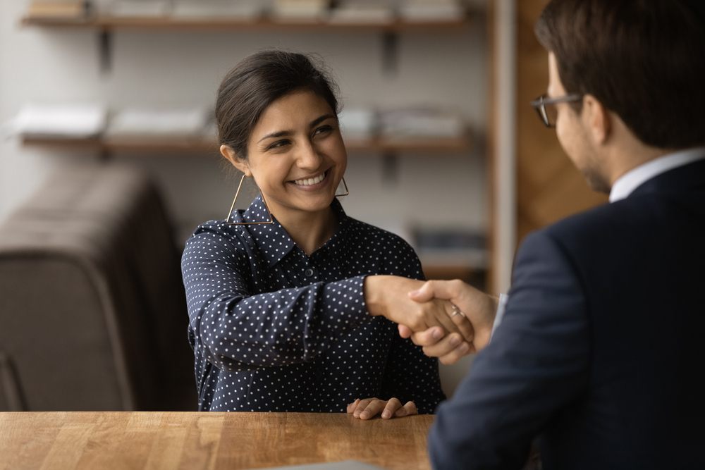 First-Time Job Seekers in Canada: A picture showing a Canadian job seeker having an handshake with recruiter after a successful interview.