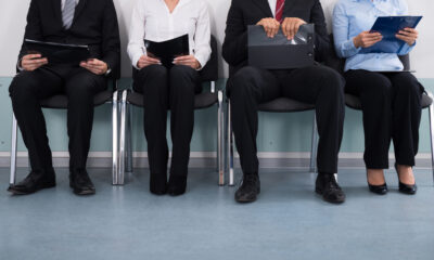 First-Time Job Seekers in Canada: A picture showing a group of first-time job seekers sitting in queue, waiting for Canadian job recruiter.