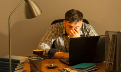 Things to Avoid When Working from Home: Picture of a male freelancer working late hours at home.