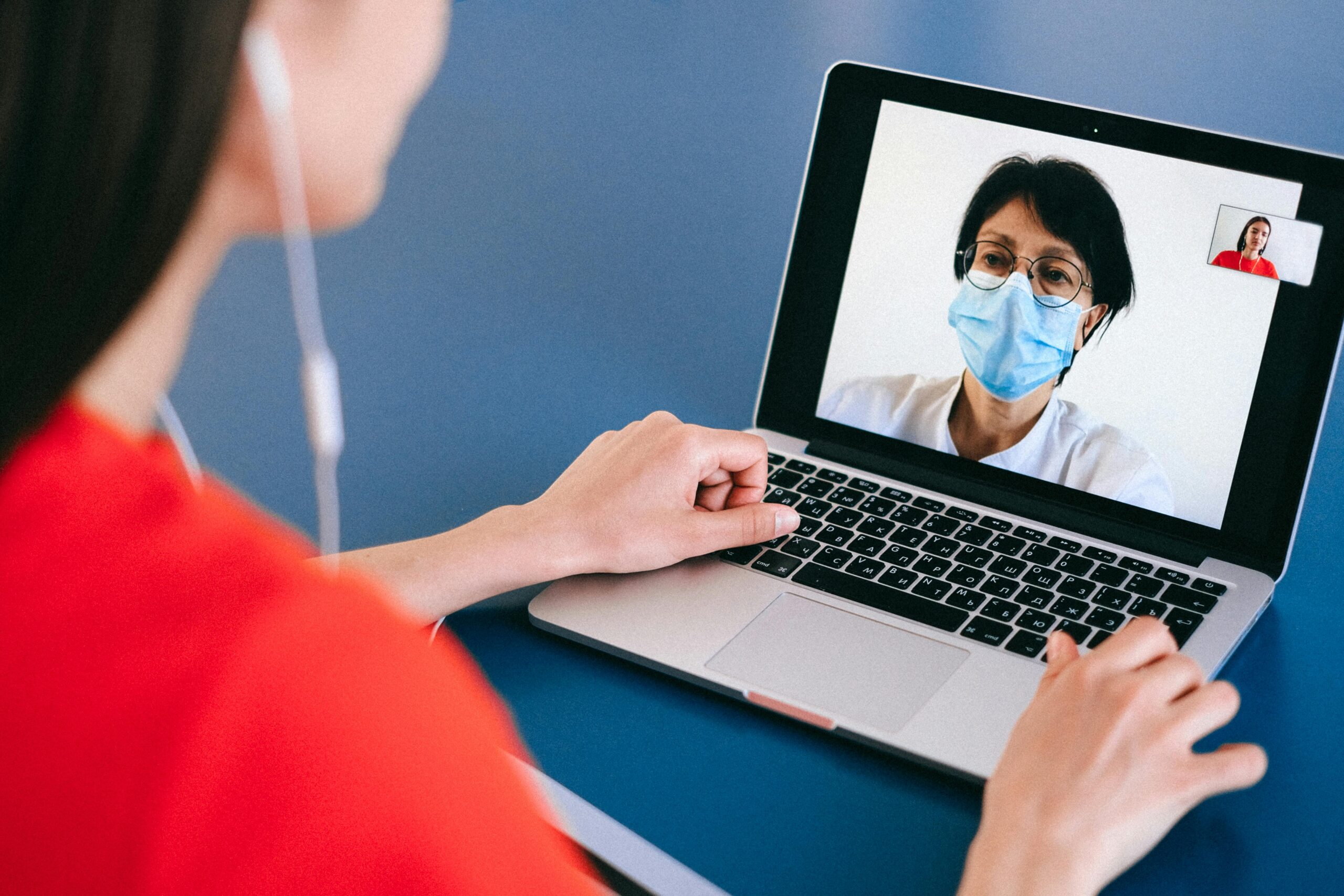 Remote Jobs in Tech vs. Remote Jobs in Healthcare: A telehealth nurse attends to her patient virtually. 