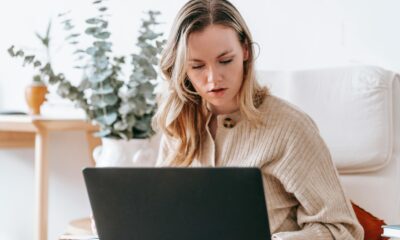 How to Avoid Remote Work Scams When Searching for Remote Work: Picture of a lady working remotely on a laptop