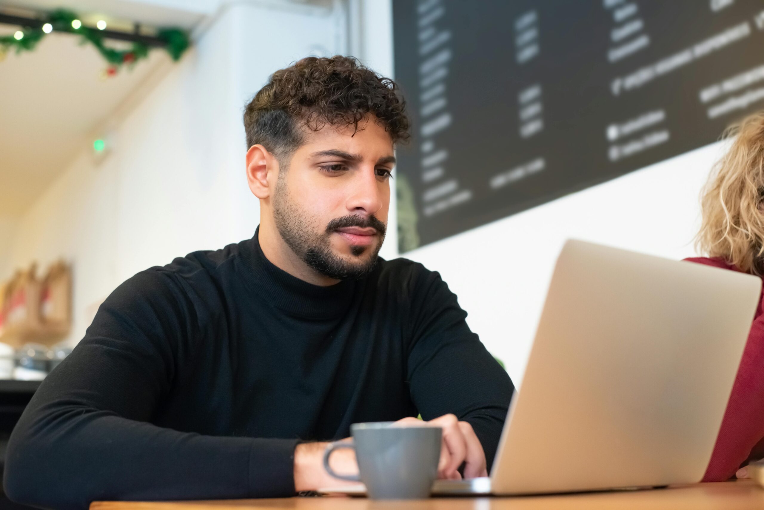 How to Avoid Burnout When Working Remotely: Picture of a man working remotely on a laptop