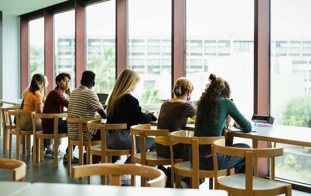 London vs Edinburgh: Picture young multiracial people studying in library - School education concept