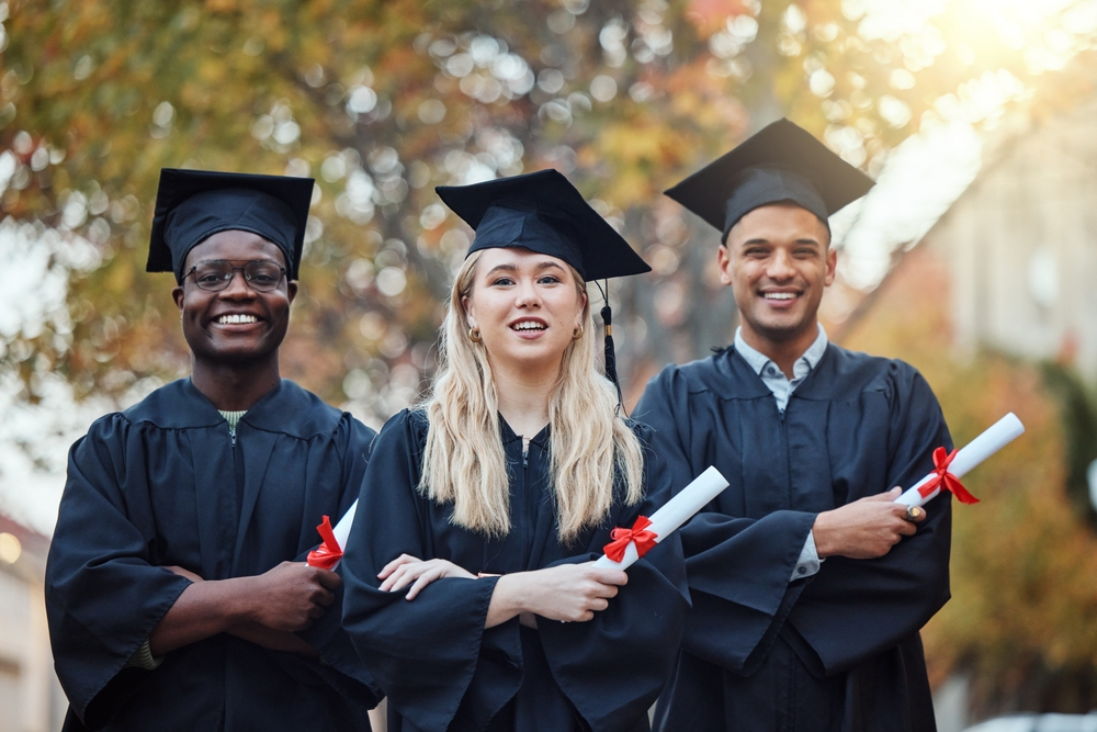 How to avoid a Canada study permit refusal: 2 males and a female in their graduation wear