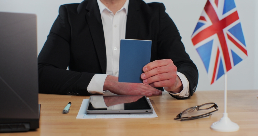 7 Secrets to Acing Your UK Work Visa Interview: British-Embassy-Man-Officer