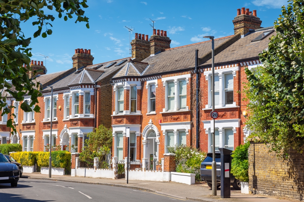 London vs Edinburgh: Traditional brick terraced houses in London.