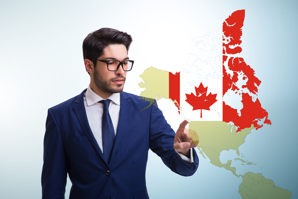 Canada Work Permit Interview: Picture of a man on suit with Canadian flag