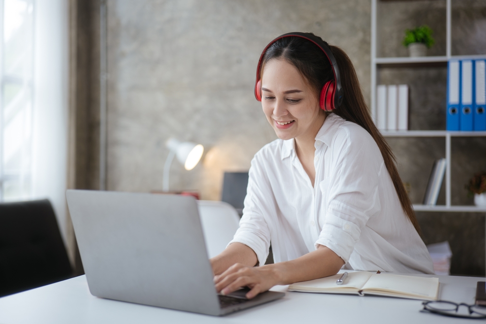 Secure Your Preffered Remote Job at Twilio: Picture of a female freelancer working remotely