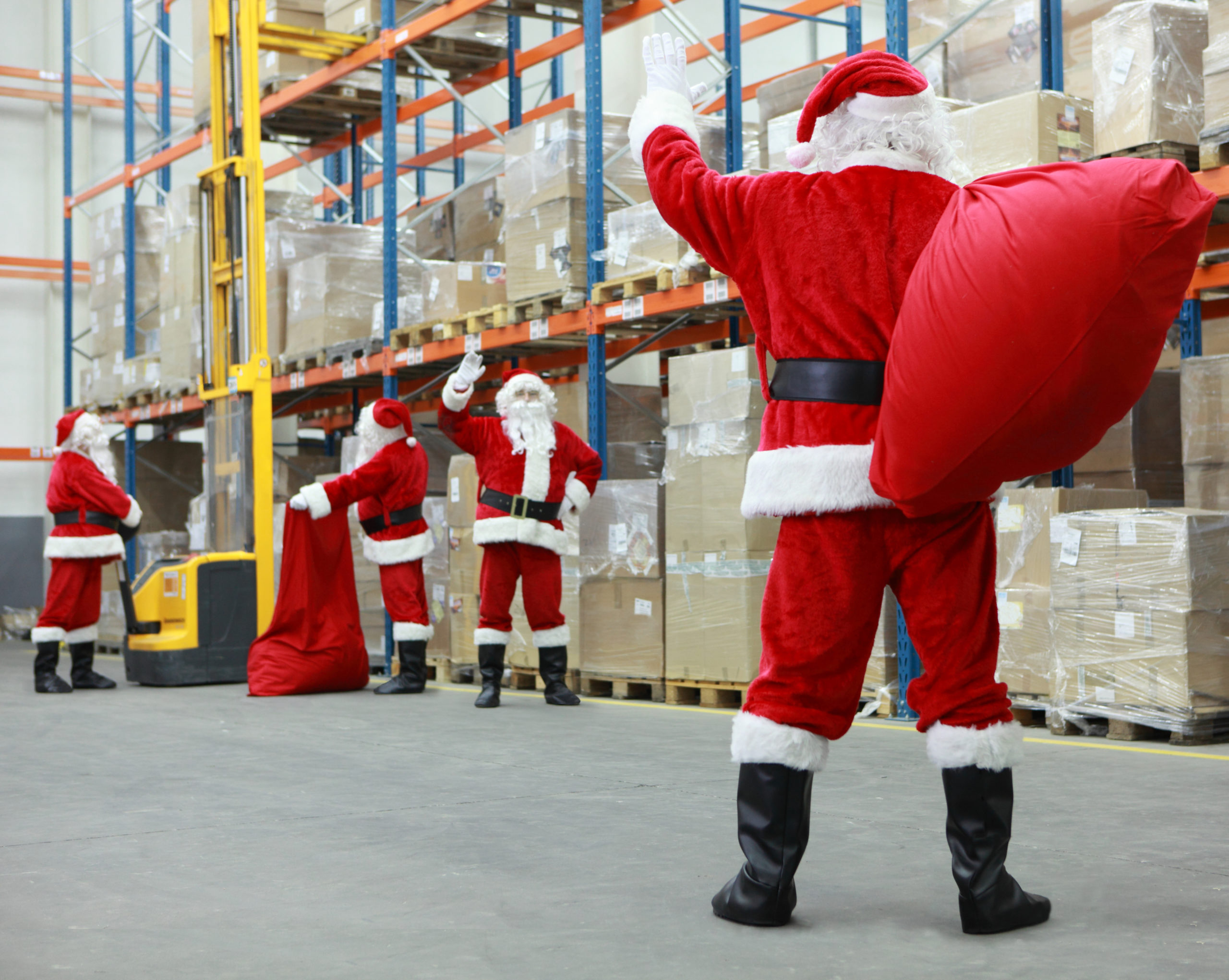 Father christmas in the warehouse, working: Christmas Jobs boom: Record-Breaking Vacancies and Salaries Light Up the UK Market